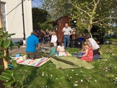 Making charcoal over campfires at Thelma Hulbert Gallery